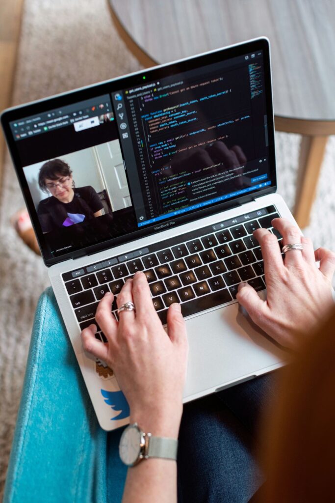 Women talking via Zoom call on laptop.